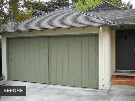 Green double garage door before renovation.