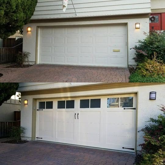 White garage door with two windows and black hardware.