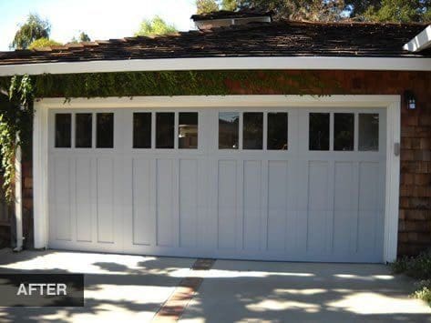 Gray garage door with glass panels.