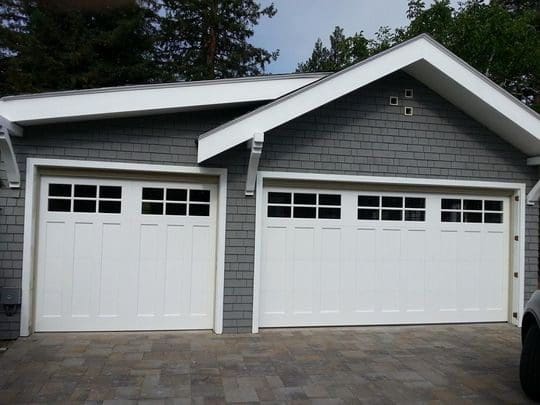 White double garage doors with windows.