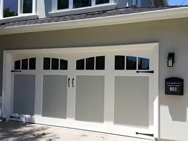 White garage door with black accents.