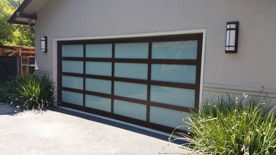 Modern garage door with frosted glass panels.